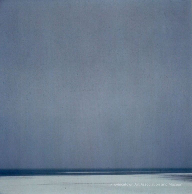 Blue-grey sky, low horizon with white harbor