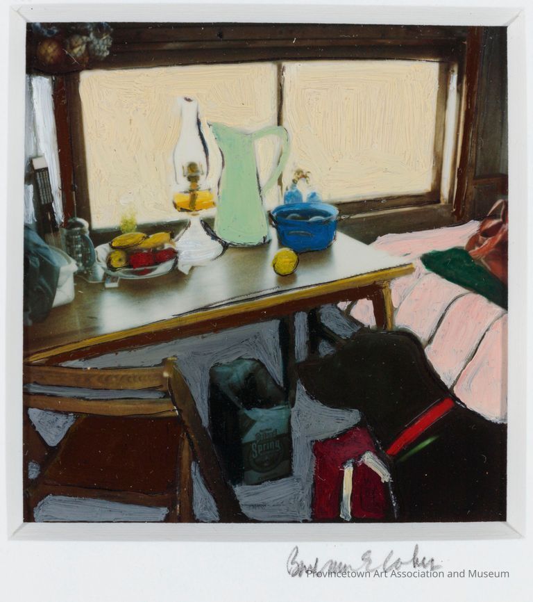 A cozy room features a table with fruits and a dog nearby