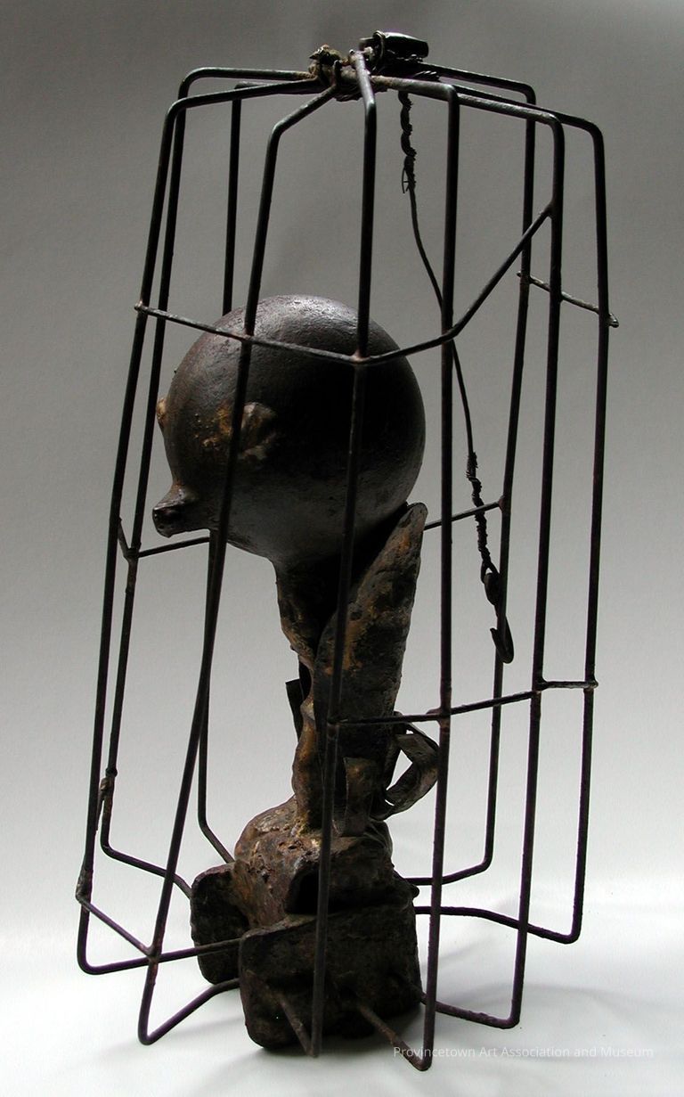 Orb figure in wire cage
