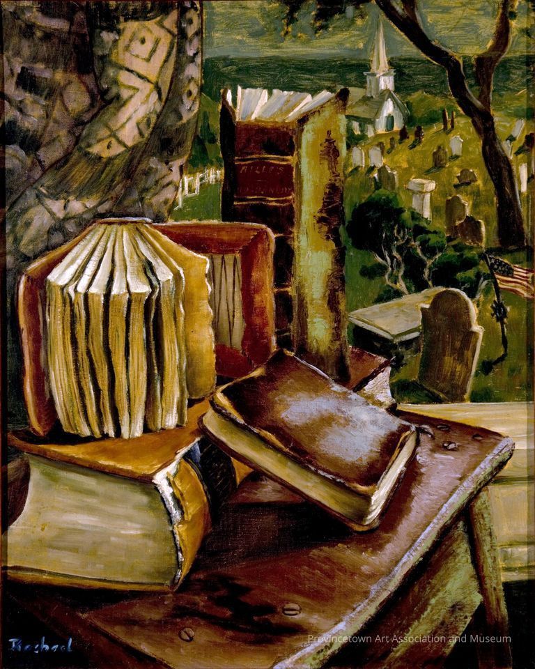 Pile of old books on a table, cemetery and church behind