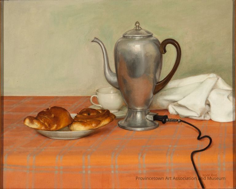 Electric tea kettle, white teacup, two pastries on a plate, on orange tablecloth
