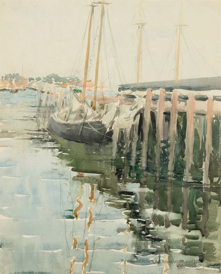 Sailboats at the wharf, calm water reflecting the boats below