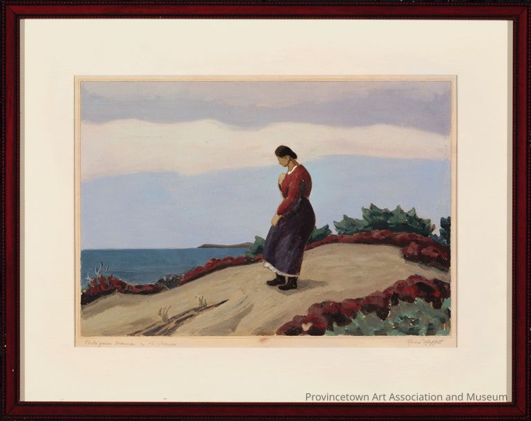 Woman wearing red and blue standing on dune mound with ocean and sky in background