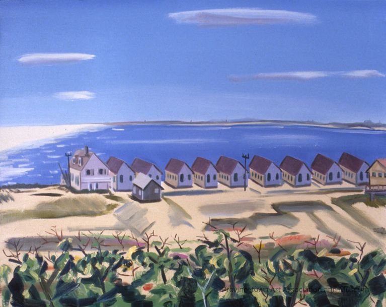 Truro cottages, seen from Route 6, with Provincetown in the background across the harbor