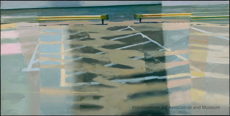 Beach, ocean, traffic barriers in a parking lot