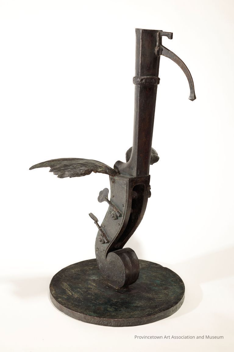 Assemblage-style bird figure with keys and other tool shapes