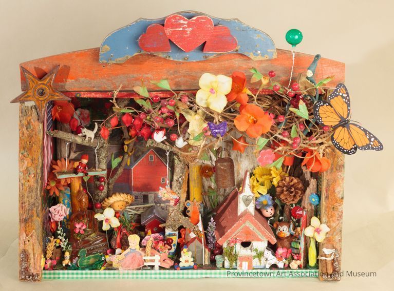Diorama assemblage of houses, flowers, butterflies