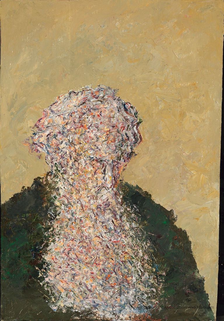 Self portrait of a man with long beard, green shirt, and facial features obscured
