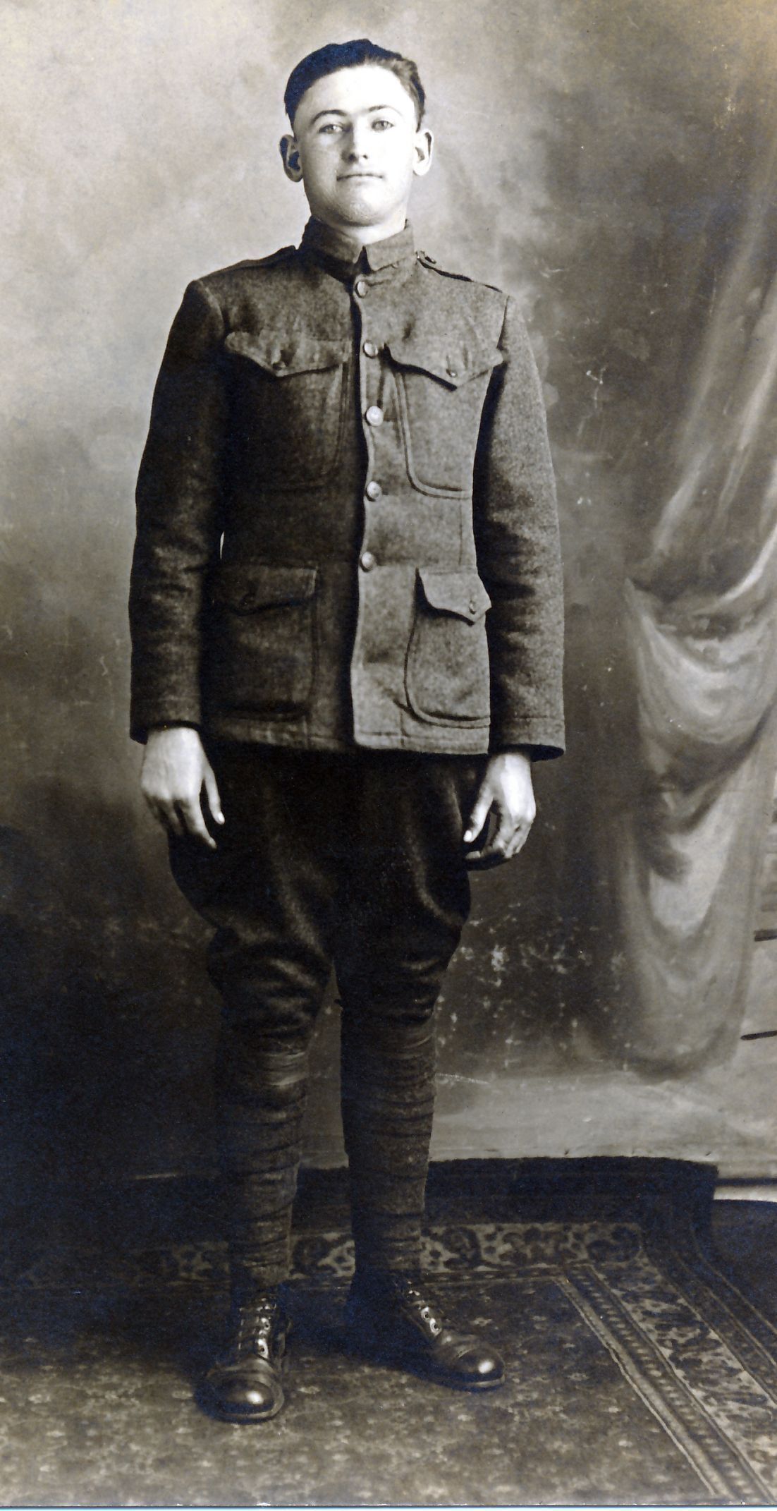 Russell Julius Mouser, military portrait, U.S. Army World War 1: Russell Mouser was born in 1893 in the Cane Creek community of Bollinger County to Troy Washington and Mary Elizabeth Eaker Mouser. After completing teacher certification at Southeast Missouri State Teachers College he taught from 1915 until his enlistment in the army in November, 1917. He completed basic training at Fort Riley, Kansas, and was assigned as a cook to Base Hospital No. 82 which was organized there on February 18, 1918. This hospital organization, whose members were recruited from all over the United States, arrived in France in September 8, 1918 and received their first patient on September 29. The hospital facility where he served had 1800 beds. The largest daily admission in a single day was 1099. He served overseas from Sept. 9, 1918 to May 28, 1919.