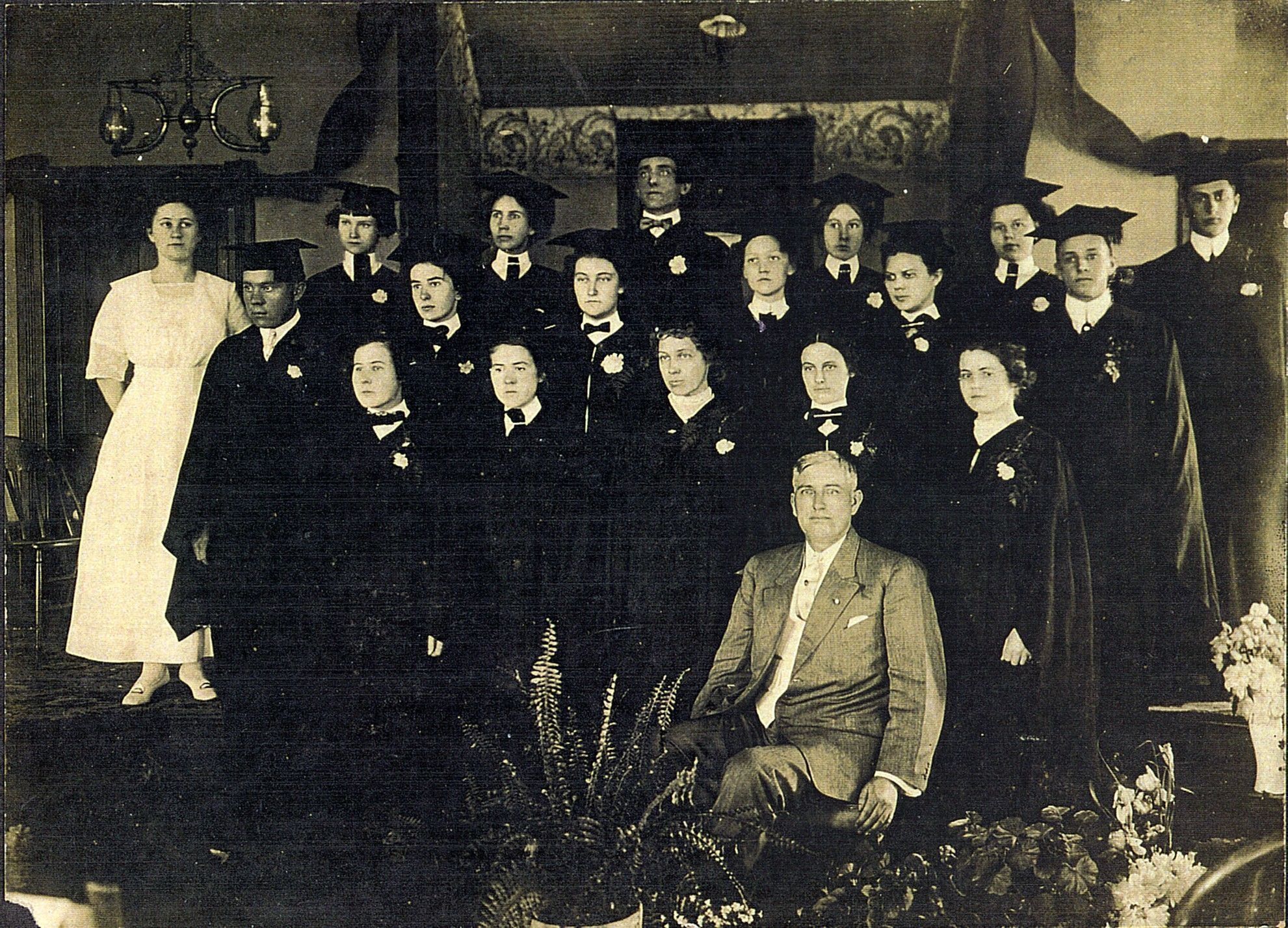 Class of 1912 graduates of Will Mayfield College, Professor A. F. Hendricks seated in front: Front row: 1. Lena Zimmerman, 2. ?, 3. ?, 4. Nola Murry (Huskey), 5. Hattie Harris
Second row: 1. Loren Grimsley, 2. Bessie Wagner, 3. Clara Jones, 4. Maude McGlothlin (Estes), 5. Lizzie Doggett, 6. Jess Williams
Third row: 1. Rhoda Conrad, 2. Maude Clow 3. Nora Hahn, 4. Charles Green, 5. Grace Sullivan, 6. Marie Wells, 7. Homer Chandler
Other grads listed in school catalog but not identified in this photo : Helen Davault, Grace McCans and Maud Wallis. Lizzie Doggett is not listed in the catalog.