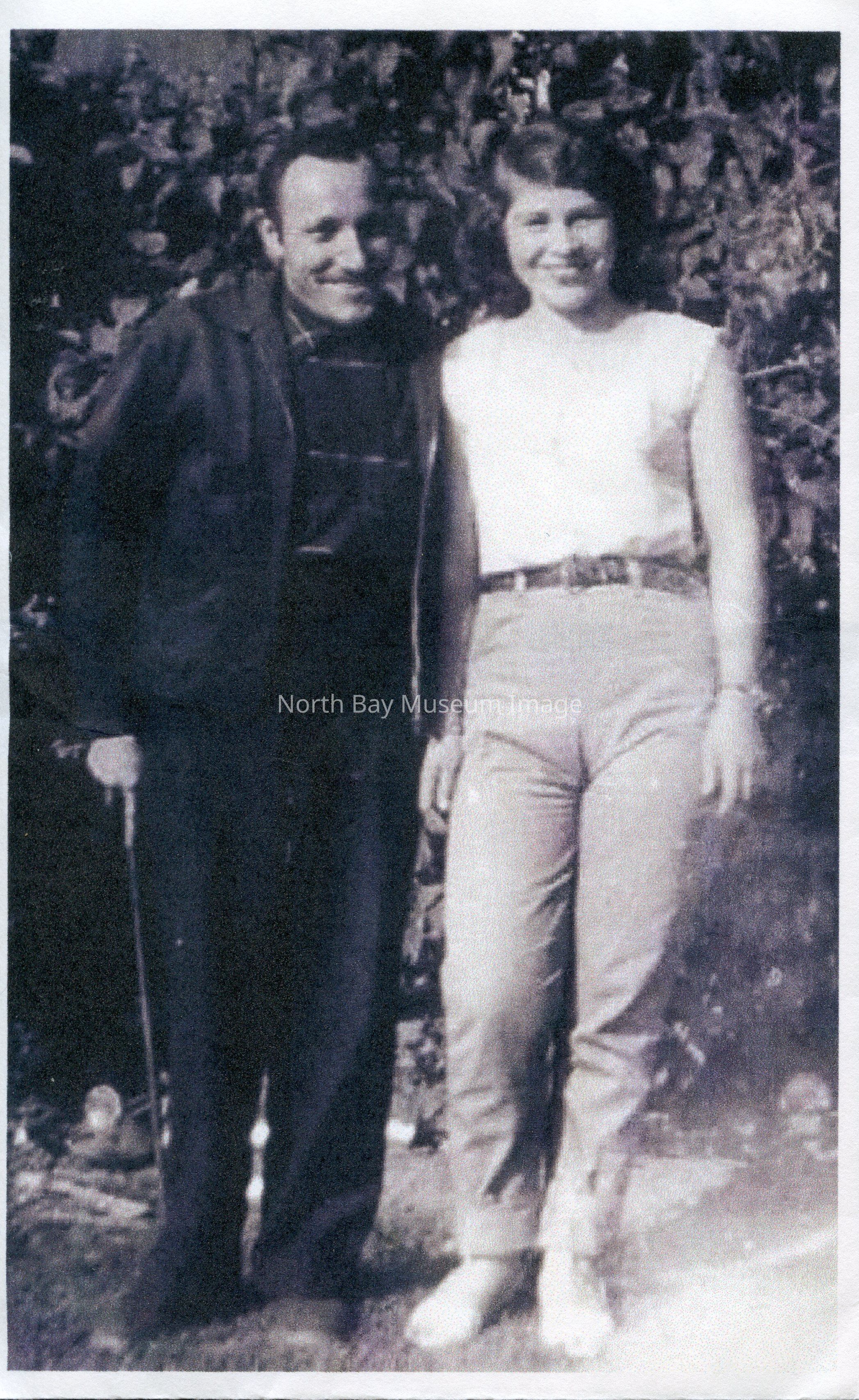 2025.01.002: Mr Wilfred Rousseau and Mrs Burdie Rousseau of Nipissing Junction before the former's crash on hwy 11 on 15 August 1960 which resulted in his death. Wilfred bears a cane in this photo. It may suggest previous experience with crashes. The photo seems to be printed on regular stationary paper from a common printer.