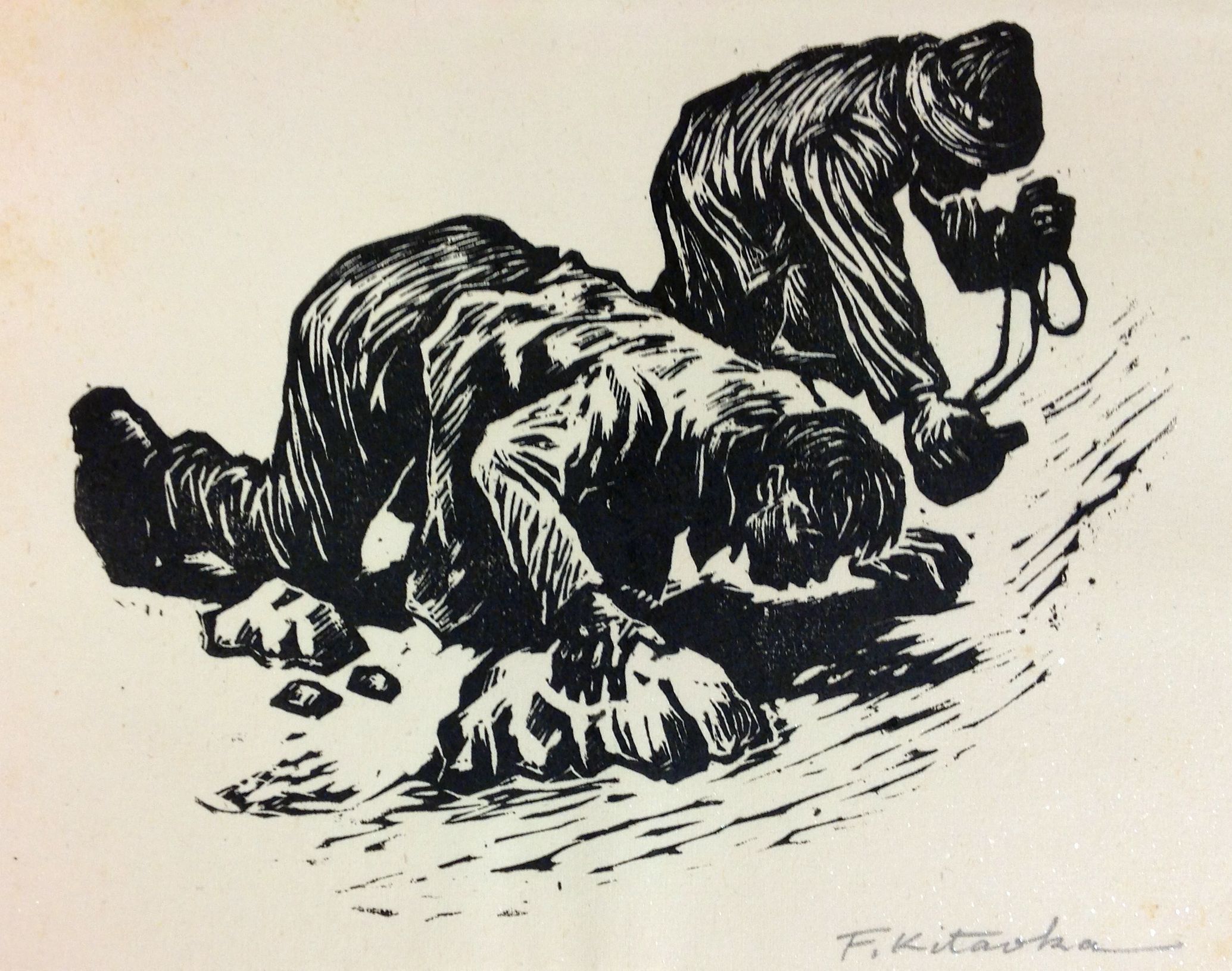 The black and white illustration depicts two figures working arduously on the ground, appearing to break rocks or hard materials with tools, highlighting the hardship and labor-intensive nature of their task. The figures are rendered with bold lines and shadows, emphasizing their physical exertion and determination while suggesting a historical or socially relevant scene.