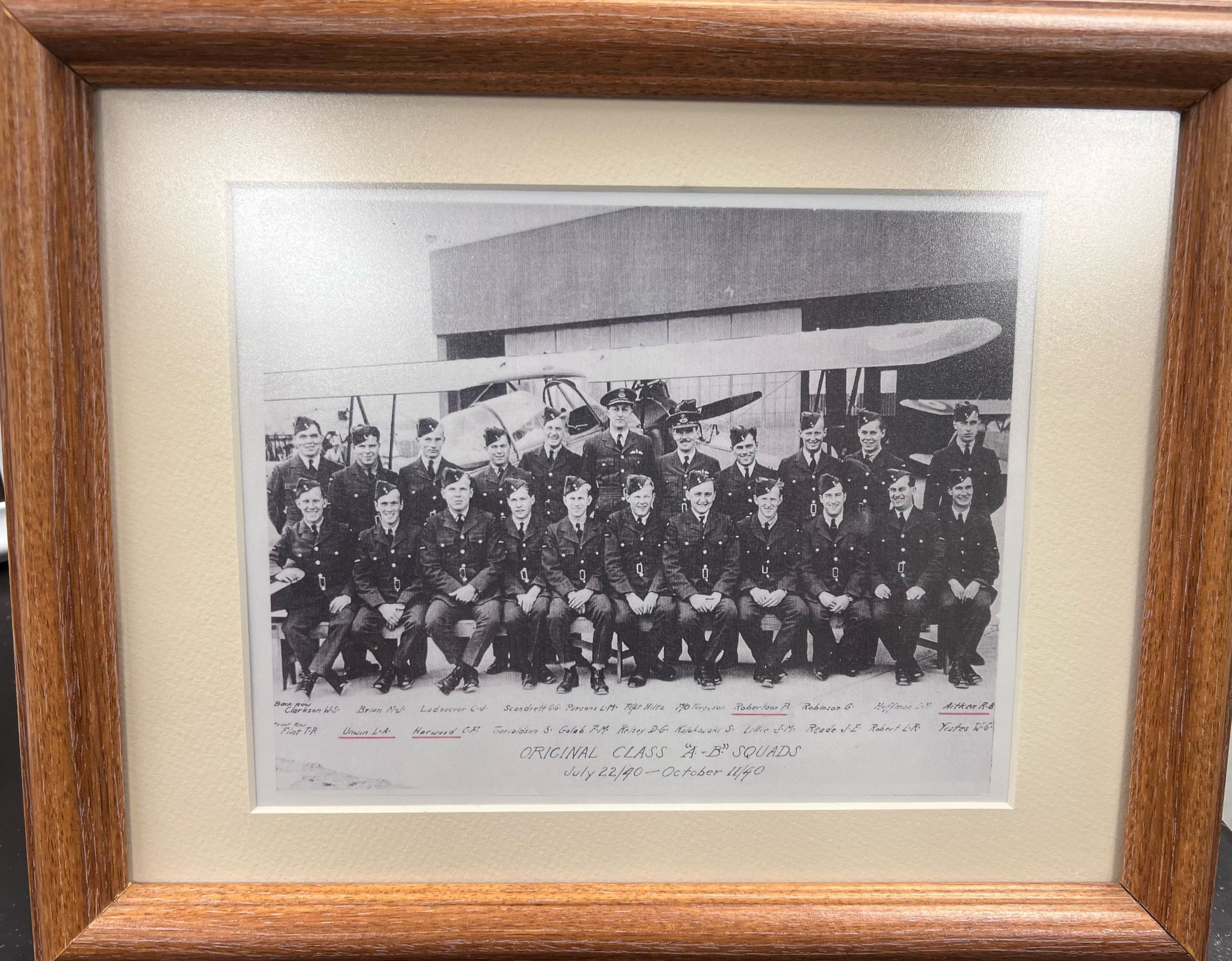 Photo taken 07-17-2025: "Back Row: Clarkson W.S., Brian M.J., Ladouceur C.J., Scandrett G.G., Parsons L.M., Fl/LT. Hiltz, F/O Ferguson, Robertson P., Robinson G., Hoffman L.M., Aitken R.B.
Front Row: Urwin L.A., Howard C.F., Thorvaldson S., Golab F.M., Kelsey D.G., Kolakowksi S., Lillie J.M.m, Reade J.E., Robert L.R., Yeates W.G.
ORIGINAL CLASS "A.-B." SQUADS
July 22/40 - October 11/40"