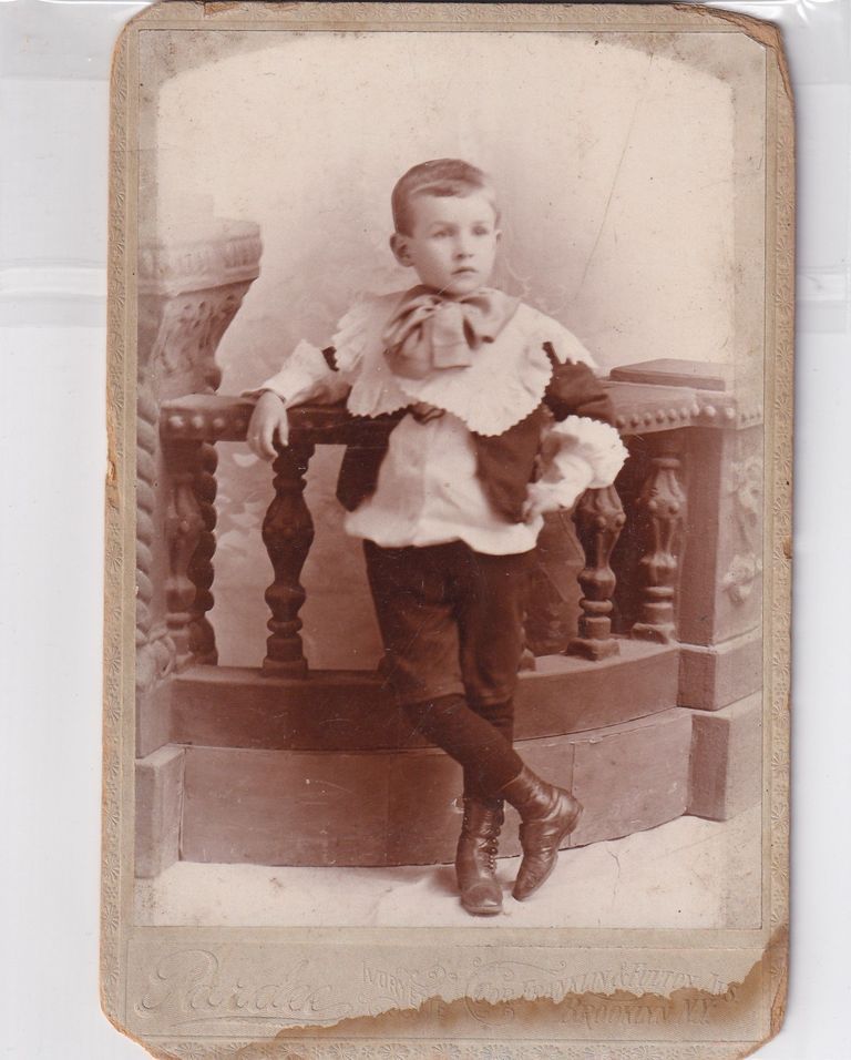 Young Boy in Decorative Collar with Oversized Bow — Studio Portrait