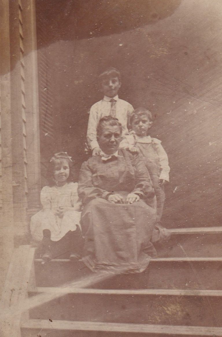 Family Portrait on Steps of Home