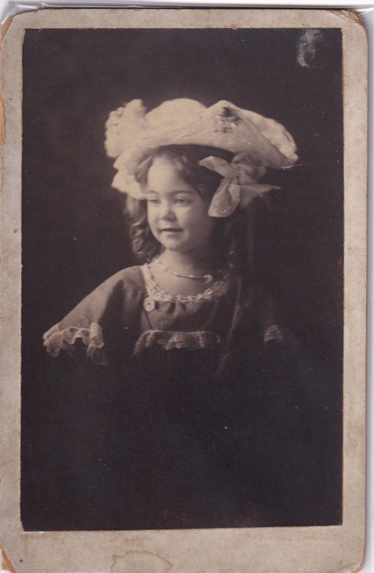 Portrait of Young Girl Wearing Oversized Decorative Hat