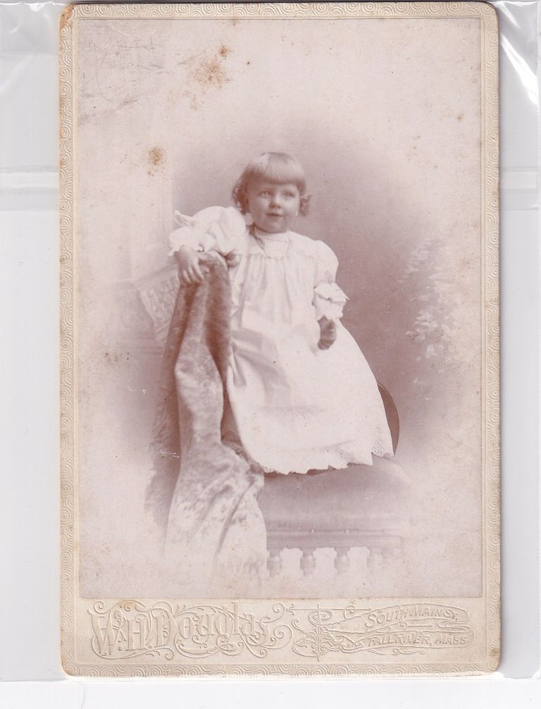 Toddler in Light Dress Leaning on Draped Studio Prop — W.H. Judkins Portrait