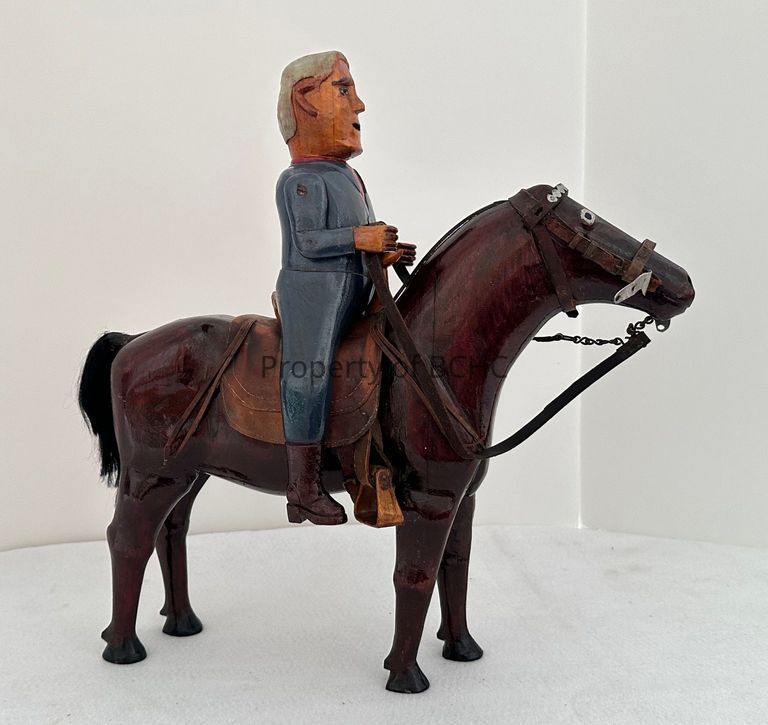 Man on horse is a 2 piece ( horse and man) wood carving done by Franco-American Folk artist, Adelard Coté. A detachable saddle is also included.