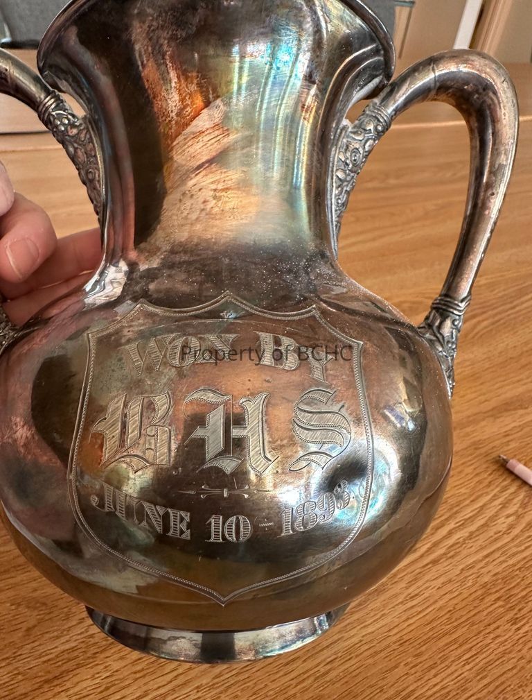 Silver plate trophy engraved with words " Won by BHS June 10, 1893"