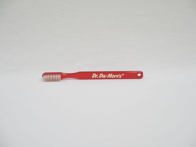 Dr. Du-More's Red Toothbrush
