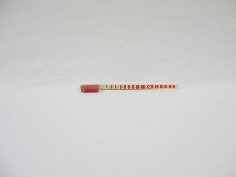 Red and Cream Striped Toothbrush
