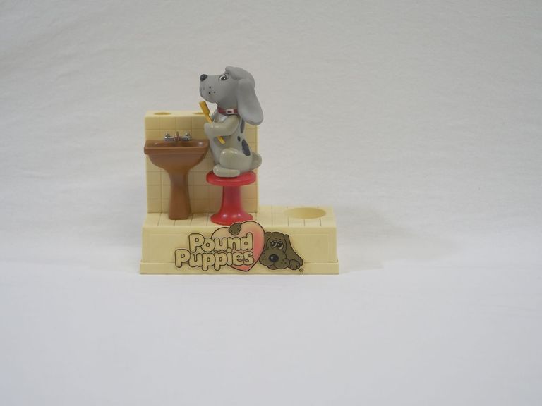 2004.68.1b Pound Puppies Batter Toothbrush Stand Untagged Front.jpg