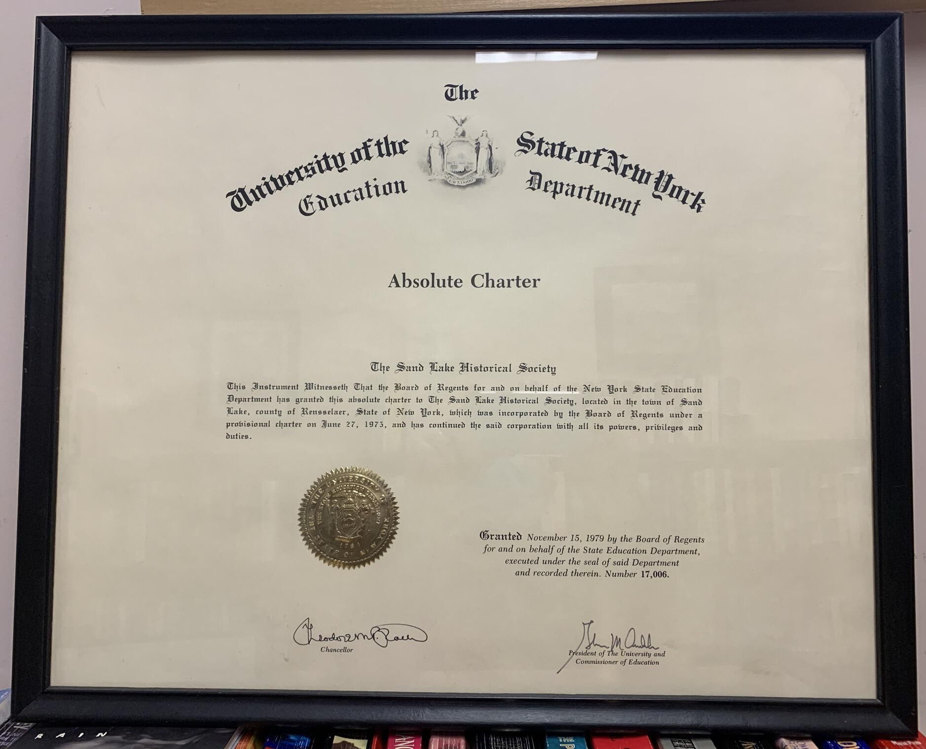 Sand Lake Historical Society Absolute Charter - 1979: Absolute Charter granted to the Sand Lake Historical Society in 1979 by the Education Department of the State of NY to replace a Provisional Charter granted in 1975 and permanently establish SLHS as a NYS recognized historical society. Currently located on top of SLHS File Cabinet 5 on the 2nd Floor of Town Hall.