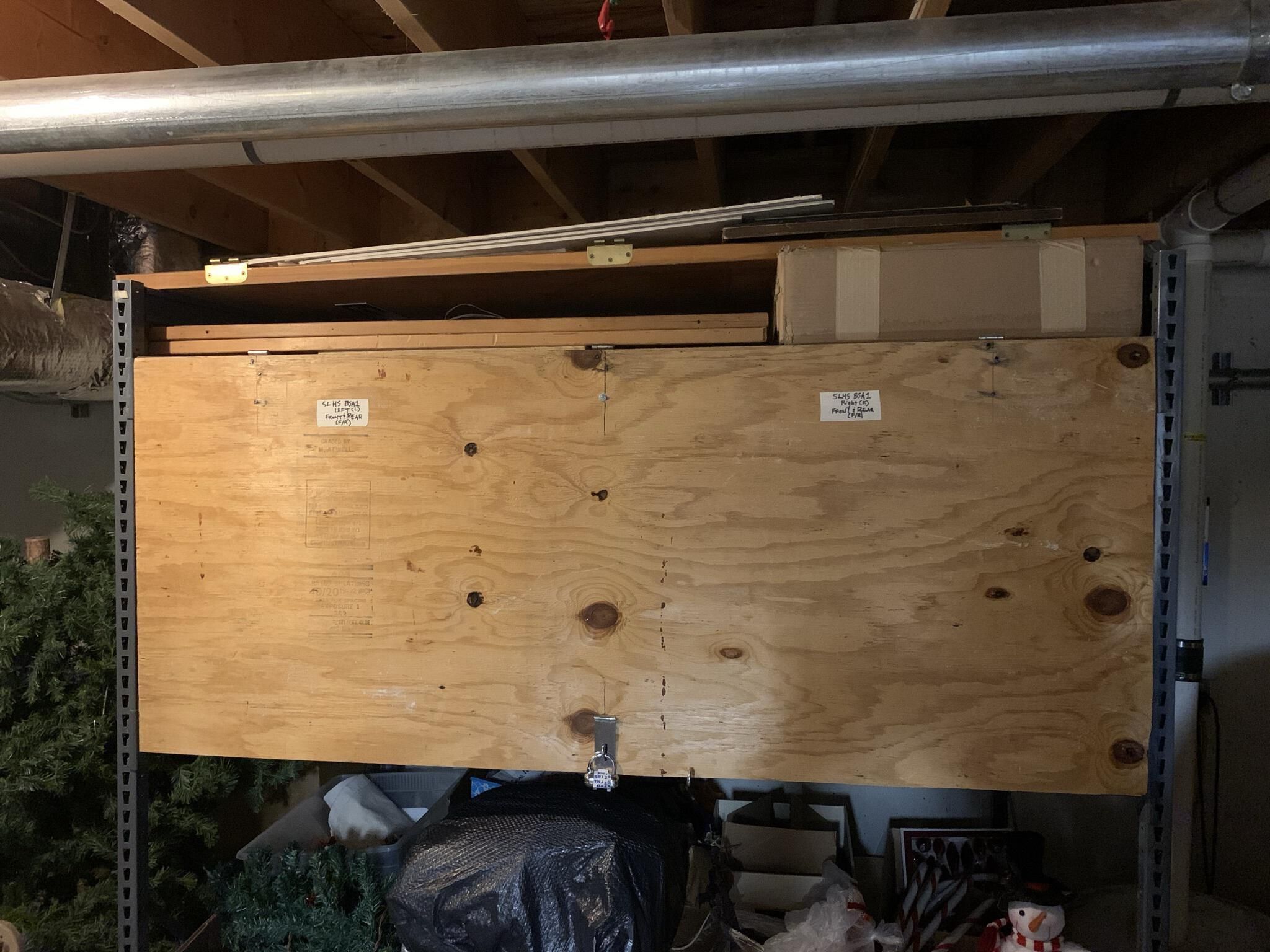 Basement Storage Area 1 (BSA 1): BSA 1 consists of an approximately 6' long x 4' deep x 3' high lockable shelf. Items stored in this location are referred to as being in BSA 1 Left or Right to help further identify their location within this large storage area. SLHS primarily uses the left side for storage of its Audio Visual and program presentation equipment. BSA 1 is located near the base of the stairs that rise toward the Courtroom side entrance to the basement of Town Hall.