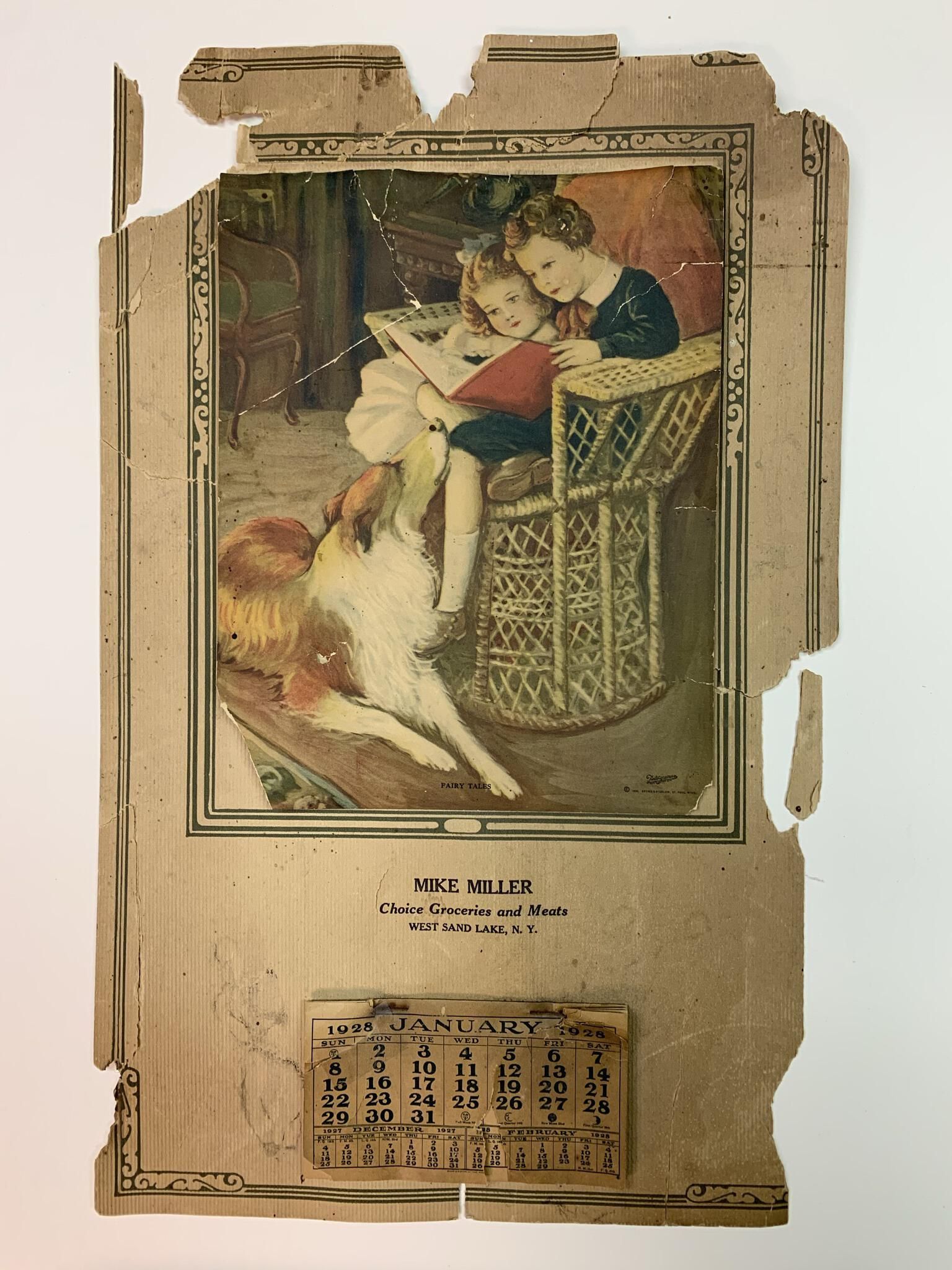 Mike Miller Choice Groceries and Meats and Calendar - Original: Mike Miller Choice Groceries and Meats Calendar as initially donated and found in the SLHS files. SLHS member Michelle Mosher repeatedly lobbied the SLHS Board of Trustees to save the calendar from completely deteriorating. This original version of this SLHS owned item is stored in a rigid frame and located on the right side of Basement Storage Area 1 in Town Hall.