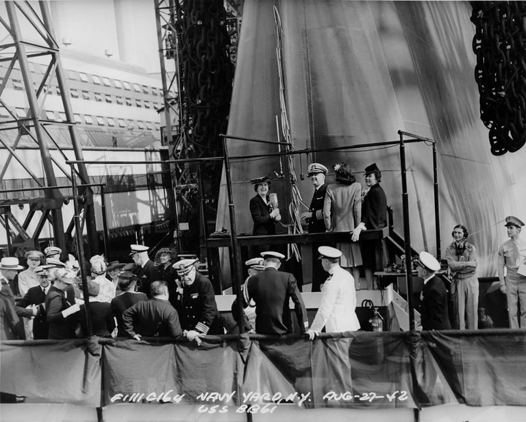          Sponsor Mrs. Wallace prepares to christen battleship Iowa. Note Mrs Roosevelt in the lower left, (wearing a hat). F1111C164 picture number 1
   
