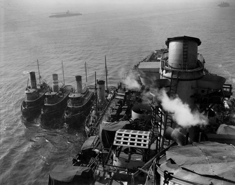          IOWA leaving New York Navy Yard for dry docking with 4 tugs on her aft starboard hull. October 20, 1942 - 80-G-13572 picture number 1
   