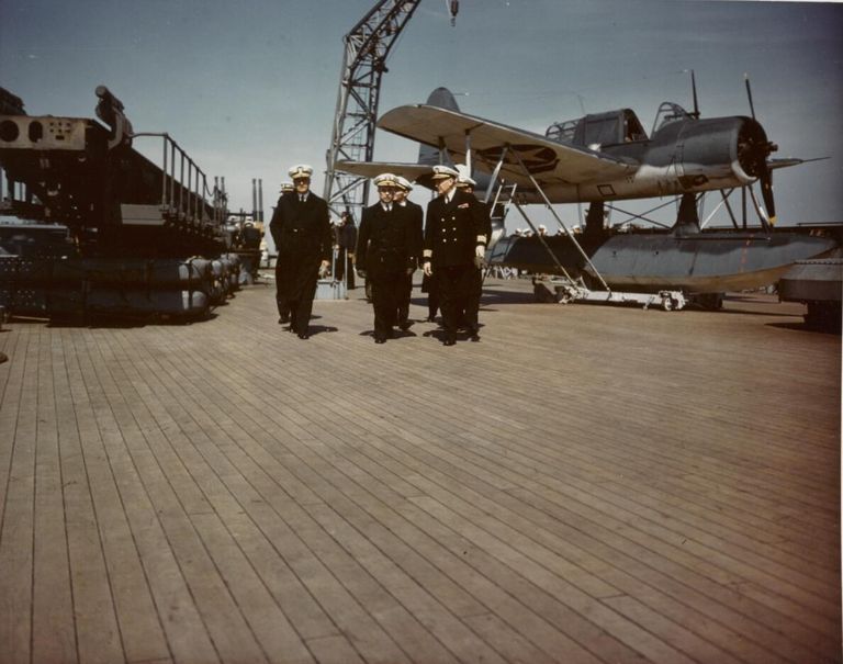          IOWA's CO Capt McCrea & officers on the stern next to a Kingfisher float plane on a dolly. cMay 1943 - 80-G-K-6118 picture number 1
   