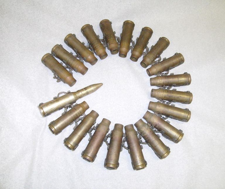          A belt of 19 expended CIWS cartridges and an all-up dummy round
   
