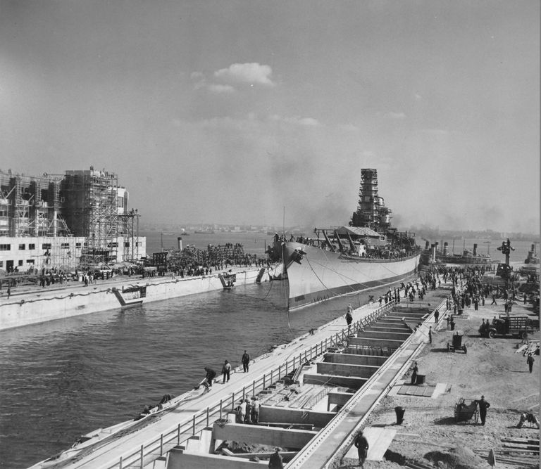          Tug boats push IOWA further into her dry dock. Note the facility is still under construction. October 20, 1942 - 80-G-13558 picture number 1
   