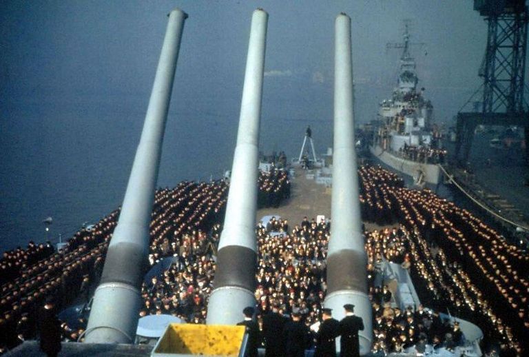          Looking aft - IOWA's crew rings the guests seated in the center. Destroyer astern appears to be USS Wainwright DD-419. 80-G-K-823 picture number 1
   