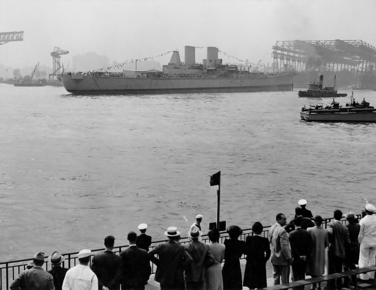          Crowds watch the launching of USS Iowa, afloat for the first time. Note the patrol boat to the right and a tug boat. 80-G-11372. picture number 1
   