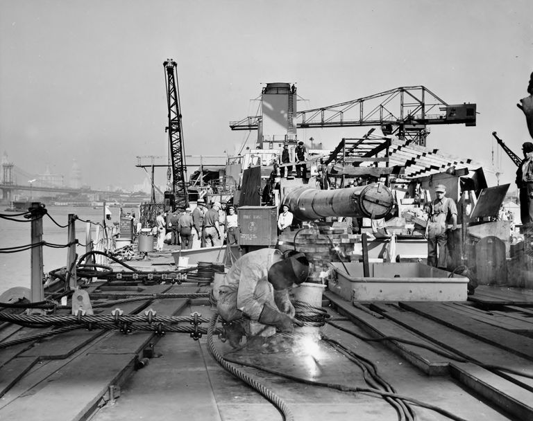          Welding on Forward Main Deck. 16 inch gun Turret 1 & superstructure begins to take shape further aft. October 1942 - 80-G-K-510 picture number 1
   