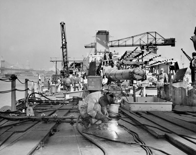 Welding on Forward Main Deck. 16 inch gun Turret 1 & superstructure begins to take shape further aft. October 1942 - 80-G-K-510 picture number 1