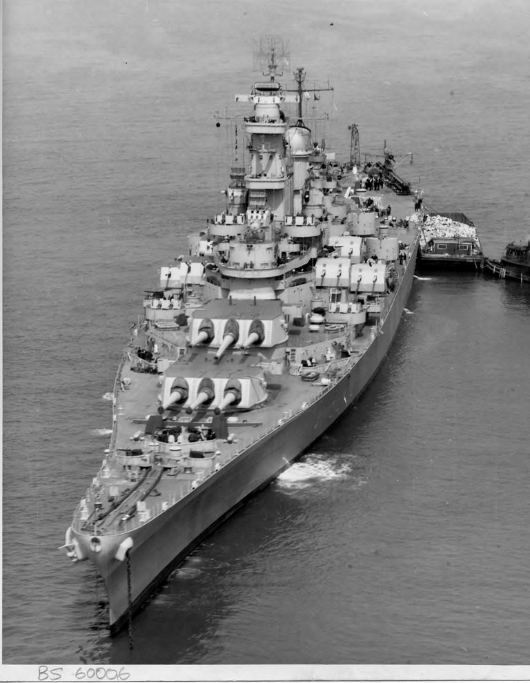          Bow view of USS Iowa anchored off New York with a trash barge placed at her port. April 7, 1943 - US Navy photo. picture number 1
   