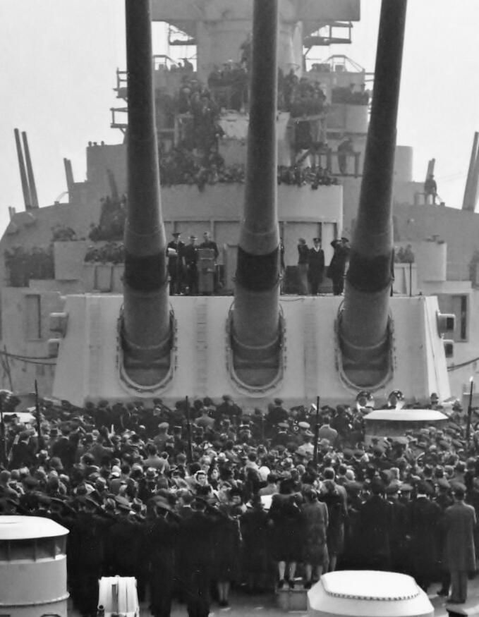          Close up of Commissioning guests watching the ceremony taking place aft of Turret 3. Feb 22, 1943. USN photograph. picture number 1
   