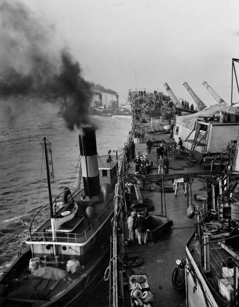          IOWA being towed with tugs forward and on her port hull for dry docking. October 20, 1942 - 80-G-13571 picture number 1
   