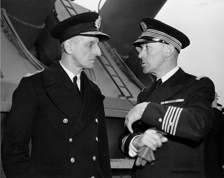         Left - Unkown Royal Navy Officer with Capt Marcel Decamond, CO of the French battleship RICHELIEU. USN photo. picture number 1
   