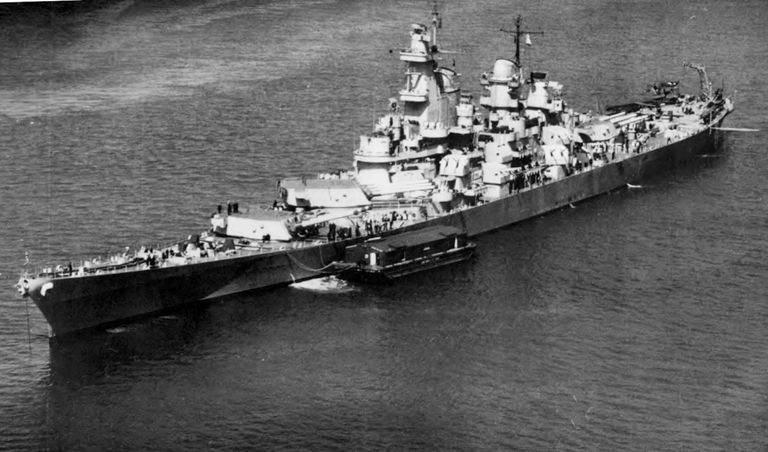          USS Iowa anchored off New York with an ammunition barge tied up at her port quarter. April 7, 1943 - US Navy photo. picture number 1
   