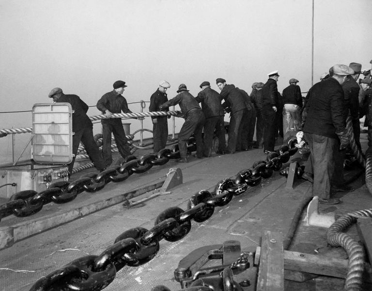          Workers on IOWA's bow adjusting lines as she was being towed to a dry dock. October 20, 1942 - 80-G-13567 picture number 1
   