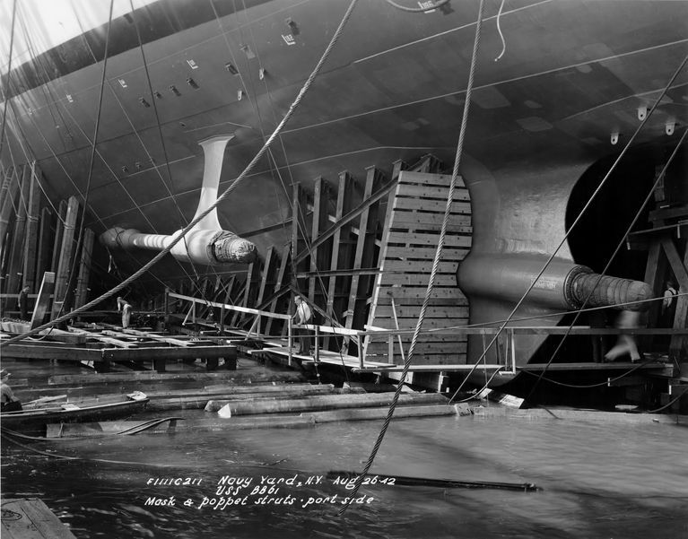          USS Iowa aft port launch mask and poppet next to the propeller struts and shafts, the day before launch - August 26, 1942 - F1111C211 picture number 1
   