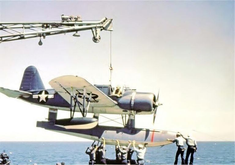          A Kingfisher float plane is being guided back onto its catapult after being craned on board. US Navy photograph. picture number 1
   