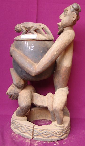 Male figure holding a pot