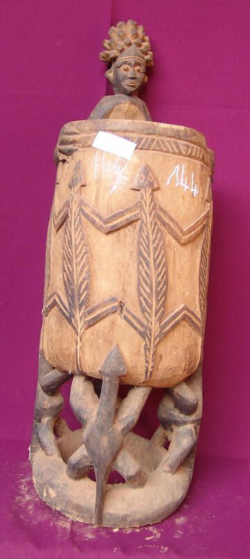 Male figure holding a pot