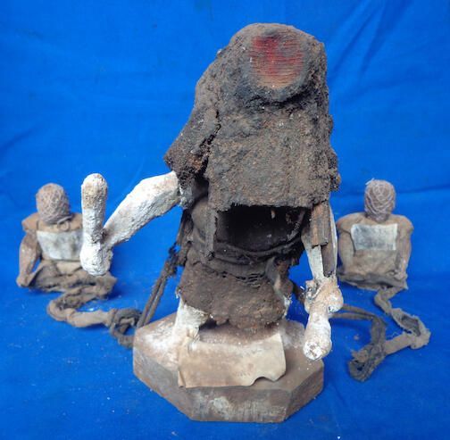 Figure of masquerade and attendants