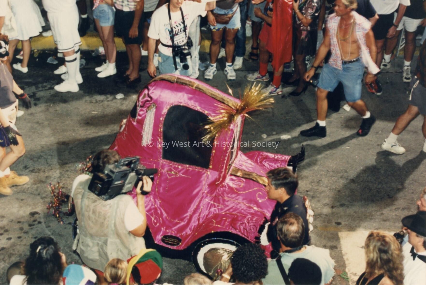 A little pink car in the parade.